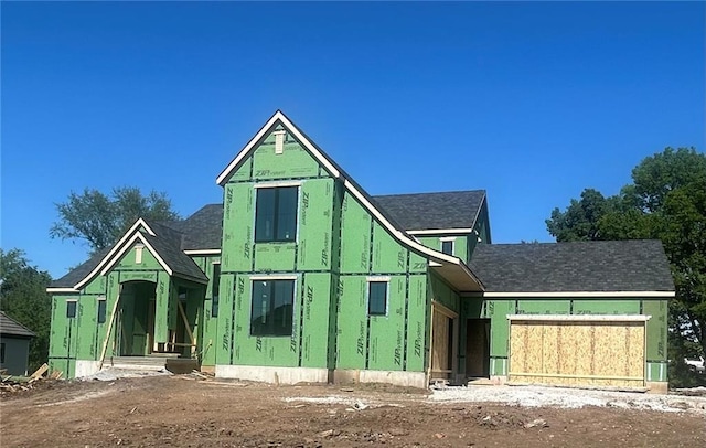 16905 Barton St, Overland Park, KS 66221 - rear view of house with a shingled roof