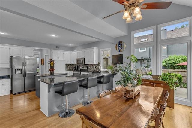 dining room with recessed lighting, light wood finished floors, and ceiling fan