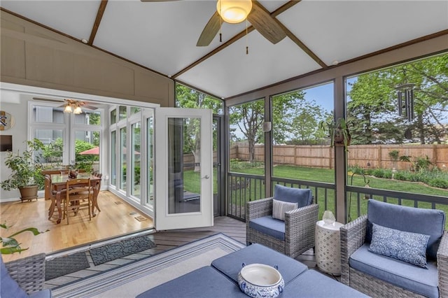 sunroom / solarium with a ceiling fan and an outdoor hangout area