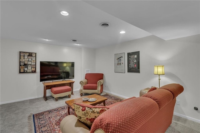 living area featuring recessed lighting, baseboards, visible vents, and carpet