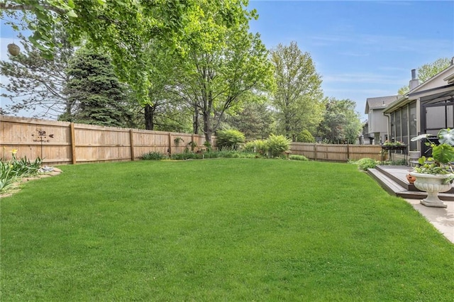 view of yard with a fenced backyard
