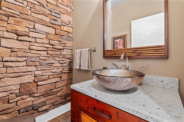 bathroom with tile patterned flooring and vanity