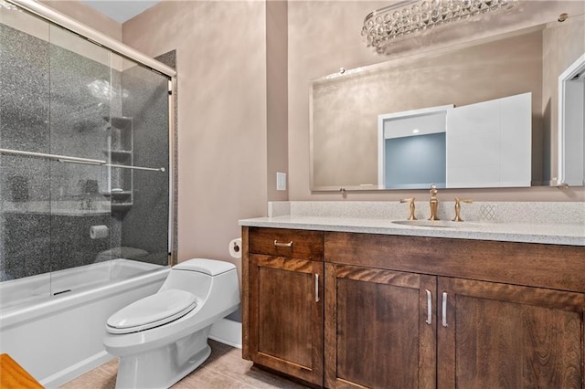 full bath with shower / bath combination with glass door, tile patterned flooring, toilet, and vanity