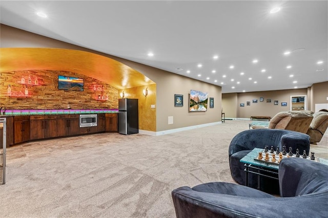 interior space featuring recessed lighting, baseboards, and light colored carpet