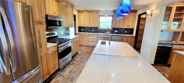 1620 Neosho St, Humboldt, KS 66748 - kitchen featuring wine cooler, recessed lighting, backsplash, and appliances with stainless steel finishes