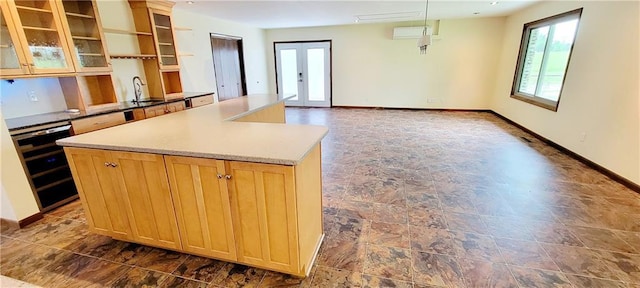 1620 Neosho St, Humboldt, KS 66748 - kitchen featuring a center island, wine cooler, a sink, and plenty of natural light