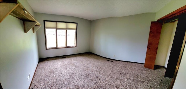 1620 Neosho St, Humboldt, KS 66748 - unfurnished bedroom with visible vents and carpet floors