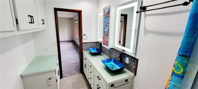 1620 Neosho St, Humboldt, KS 66748 - interior space with tile patterned flooring, vanity, and tasteful backsplash