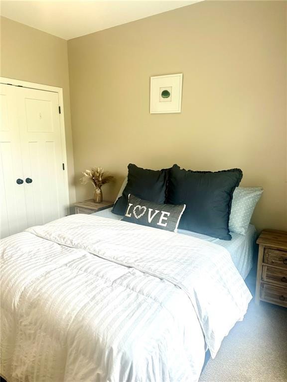 bedroom with a closet and carpet
