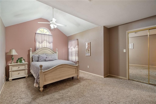 bedroom featuring a ceiling fan, vaulted ceiling, carpet, and a closet
