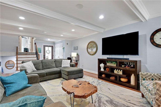 living room featuring ornamental molding, beam ceiling, and wood finished floors