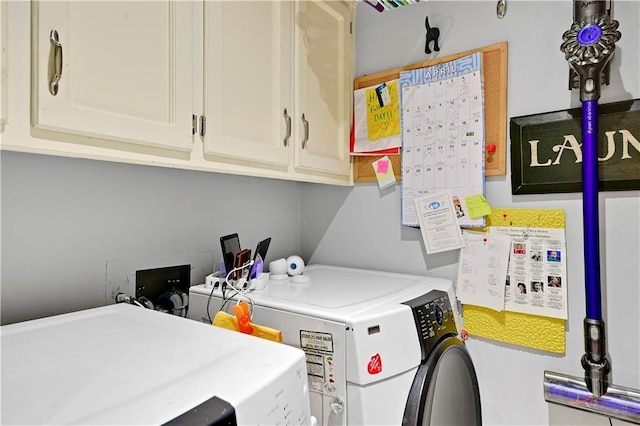 laundry room with cabinet space and separate washer and dryer