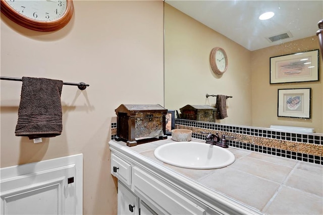 bathroom with visible vents and vanity