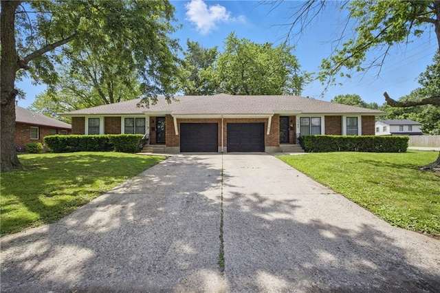 5900 Westridge Rd, Kansas City, MO 64133 - ranch-style house featuring an attached garage, brick siding, a front lawn, and concrete driveway