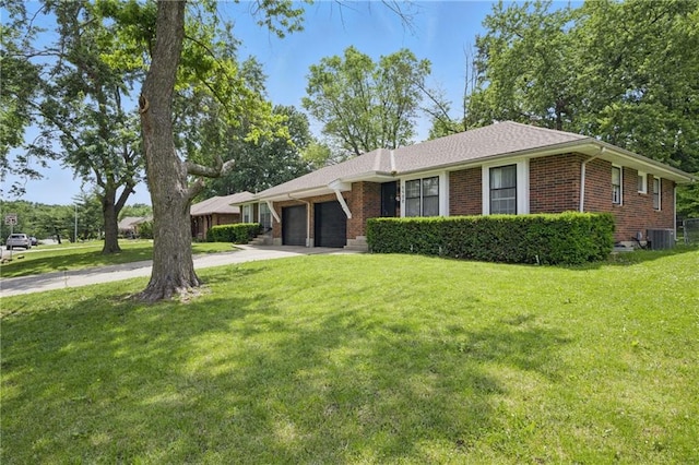 5900 Westridge Rd, Kansas City, MO 64133 - single story home featuring a garage, central air condition unit, brick siding, a front lawn, and driveway