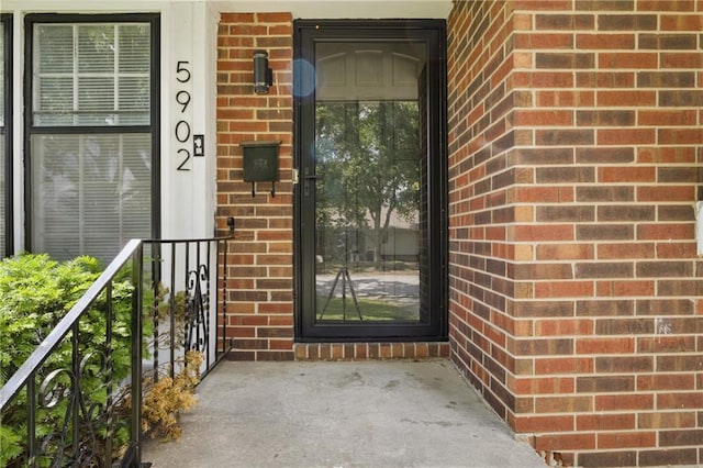 5900 Westridge Rd, Kansas City, MO 64133 - property entrance featuring brick siding