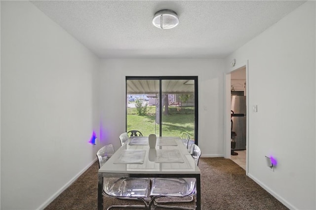5900 Westridge Rd, Kansas City, MO 64133 - carpeted dining space with a textured ceiling and baseboards