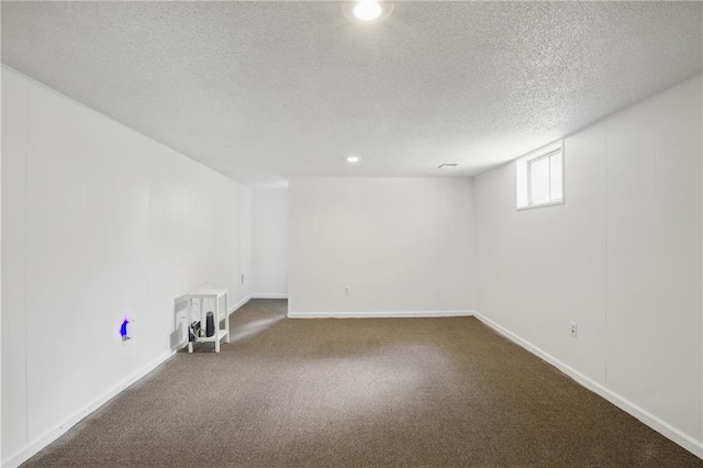 5900 Westridge Rd, Kansas City, MO 64133 - unfurnished room featuring dark colored carpet, a textured ceiling, baseboards, and recessed lighting
