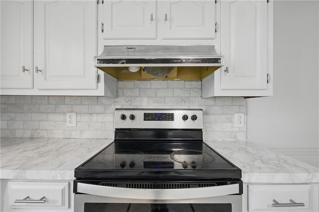 5900 Westridge Rd, Kansas City, MO 64133 - kitchen featuring stainless steel electric stove, under cabinet range hood, white cabinetry, and decorative backsplash