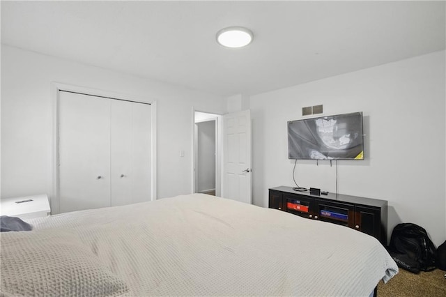 5900 Westridge Rd, Kansas City, MO 64133 - bedroom featuring a closet and carpet floors