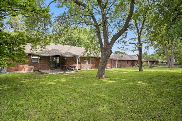 5900 Westridge Rd, Kansas City, MO 64133 - view of yard featuring a patio area