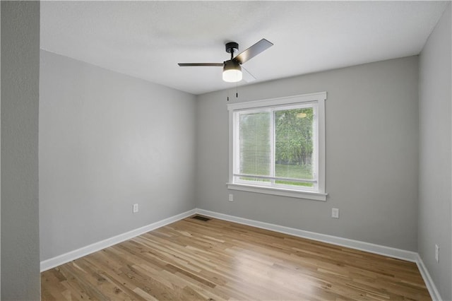 2640 S 53rd St, Kansas City, KS 66106 - spare room featuring baseboards, light wood-type flooring, visible vents, and a ceiling fan