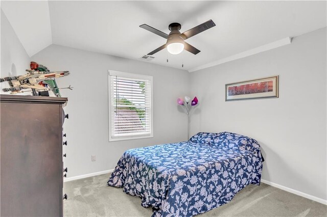 bedroom with carpet flooring, baseboards, visible vents, and ceiling fan