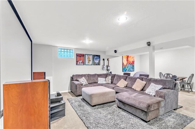 living area with recessed lighting, baseboards, and light carpet