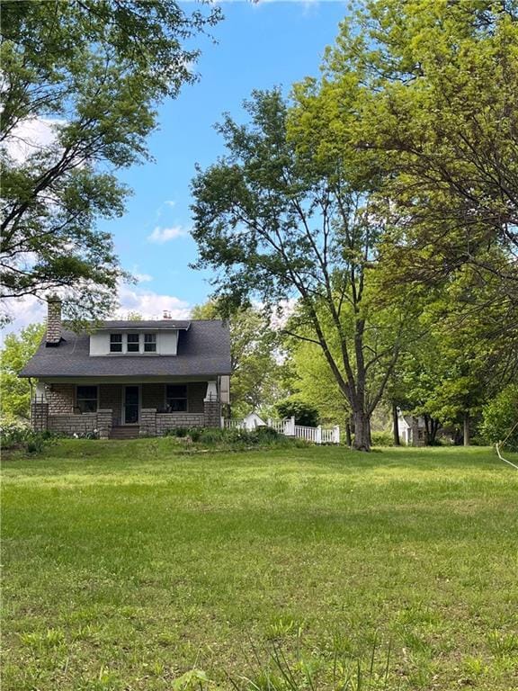 view of yard with covered porch