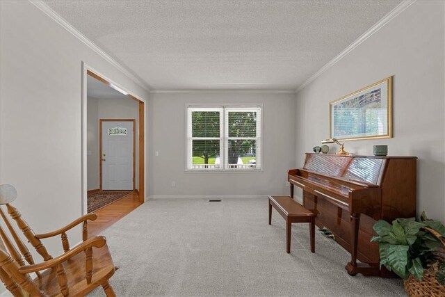 12606 Slater St, Overland Park, KS 66213 - sitting room featuring carpet floors, crown molding, and a textured ceiling