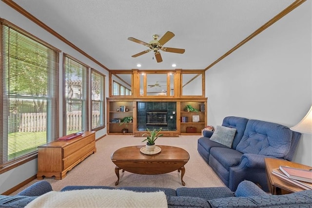 12606 Slater St, Overland Park, KS 66213 - carpeted living area with crown molding, ceiling fan, healthy amount of natural light, a fireplace, and recessed lighting