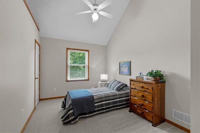 12606 Slater St, Overland Park, KS 66213 - bedroom featuring light colored carpet, lofted ceiling, and ceiling fan