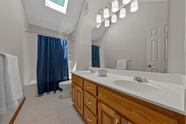 12606 Slater St, Overland Park, KS 66213 - full bath with a skylight, double vanity, vaulted ceiling, shower / bathtub combination with curtain, and tile patterned floors