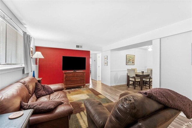 8215 Santa Fe Dr Unit 10, Overland Park, KS 66204 - living room with visible vents and wood finished floors