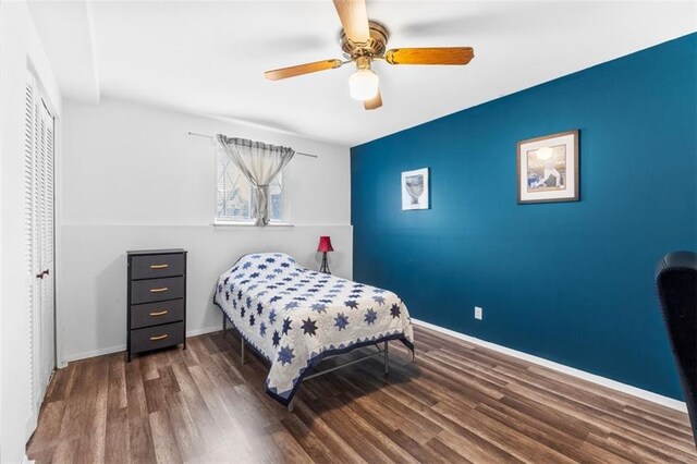 8215 Santa Fe Dr Unit 10, Overland Park, KS 66204 - bedroom featuring baseboards, ceiling fan, wood finished floors, and a closet
