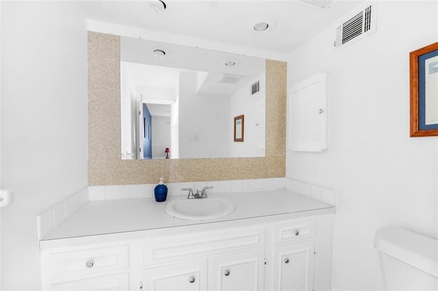 8215 Santa Fe Dr Unit 10, Overland Park, KS 66204 - bathroom featuring vanity, toilet, and visible vents
