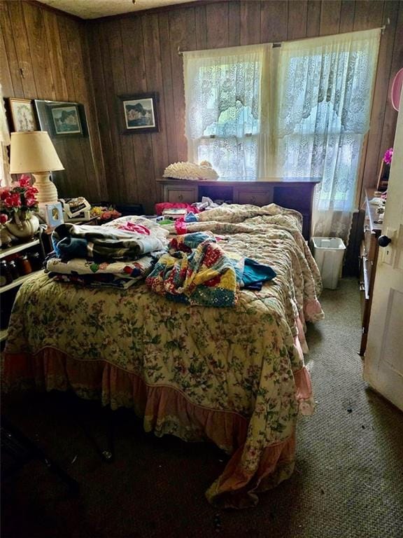 3526 Belmont Ave, Parsons, KS 67357 - bedroom with carpet floors and wooden walls