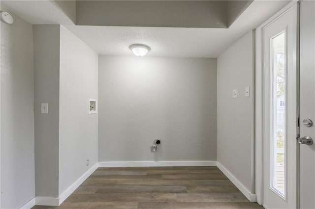 laundry room featuring laundry area, baseboards, washer hookup, and wood finished floors