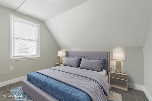 bedroom featuring vaulted ceiling, baseboards, and carpet flooring