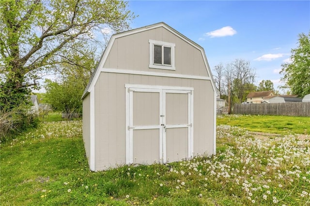 view of shed with fence