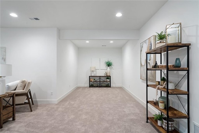 interior space featuring carpet flooring, recessed lighting, baseboards, and visible vents