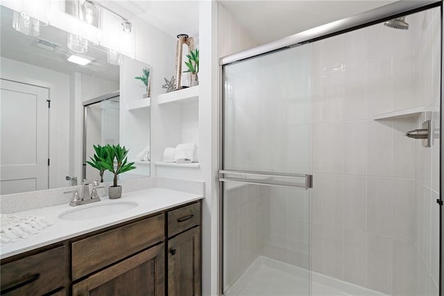 bathroom featuring vanity and a stall shower