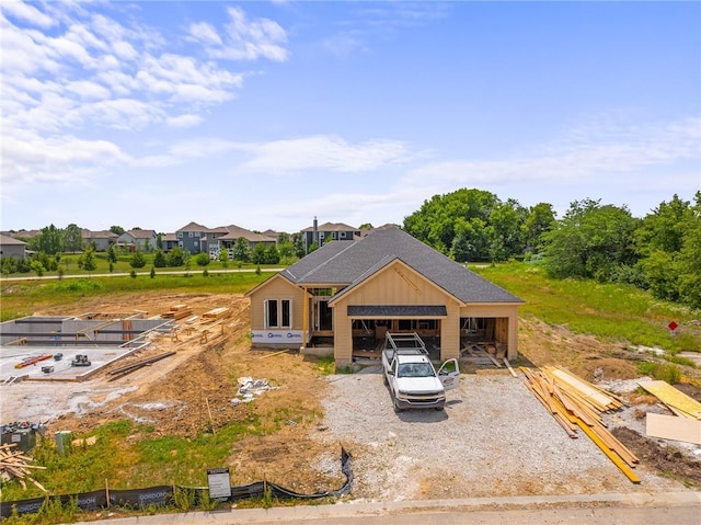 25013 W 90th Ter, Lenexa, KS 66227 - back of property featuring board and batten siding and a shingled roof