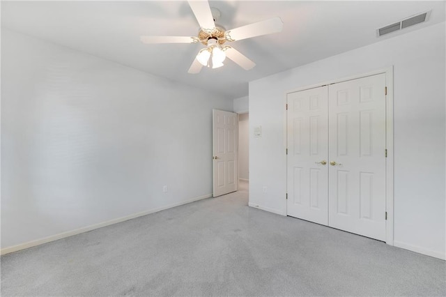 2269 SW Park Ave, Blue Springs, MO 64015 - unfurnished bedroom with carpet flooring, a closet, and ceiling fan