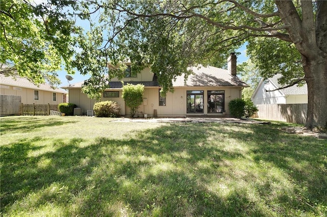 2269 SW Park Ave, Blue Springs, MO 64015 - rear view of property with a chimney