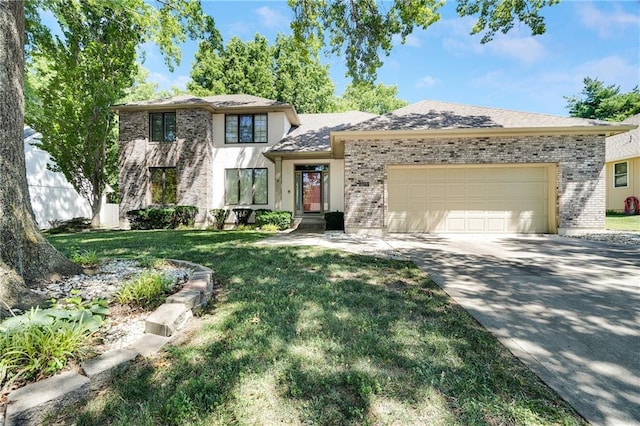 2269 SW Park Ave, Blue Springs, MO 64015 - view of front of house with a garage, driveway, a front lawn, and brick siding