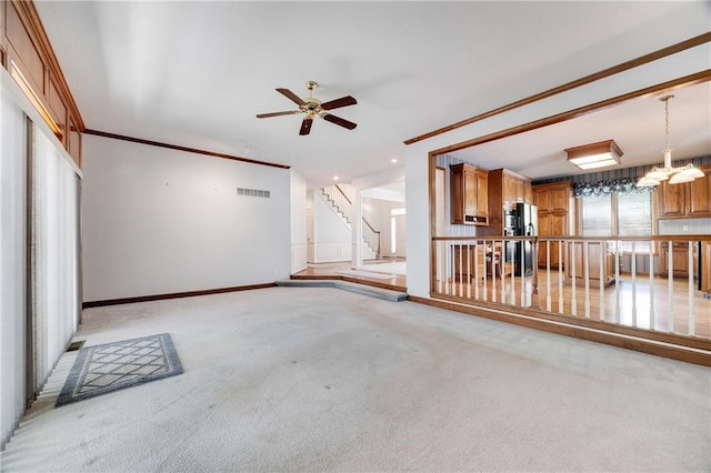 2269 SW Park Ave, Blue Springs, MO 64015 - unfurnished living room with light carpet, a ceiling fan, and stairs