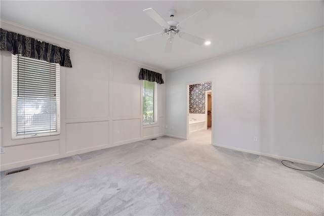 2269 SW Park Ave, Blue Springs, MO 64015 - carpeted spare room featuring crown molding and ceiling fan