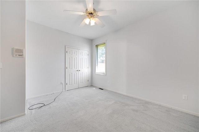 2269 SW Park Ave, Blue Springs, MO 64015 - unfurnished bedroom with carpet, a closet, and ceiling fan