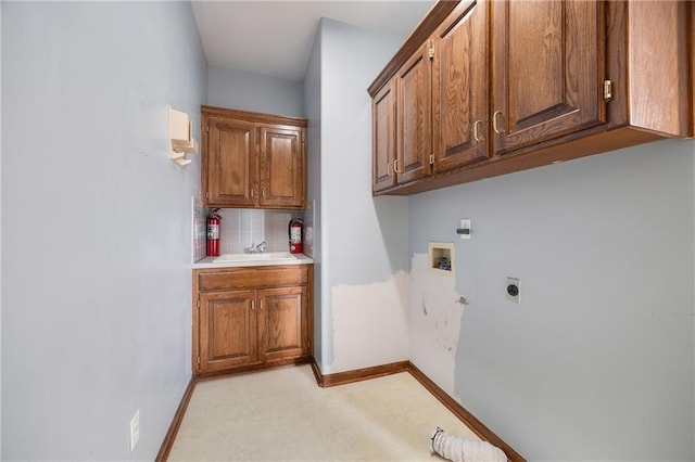 2269 SW Park Ave, Blue Springs, MO 64015 - laundry room featuring cabinet space, hookup for an electric dryer, and hookup for a washing machine